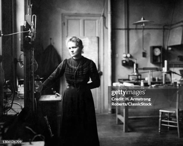 Polish-French physicist Marie Curie in a laboratory, circa 1905. Photo By Henri Manuel, Paris, France.