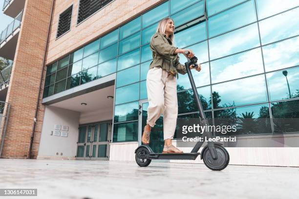 woman commuting to work - mobility scooter stock pictures, royalty-free photos & images