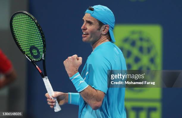 Malek Jaziri of Tunisia celebrates in his Round One match against Norbert Gombos of Slovakia during Day Two of the Qatar ExxonMobil Open 2021 at...