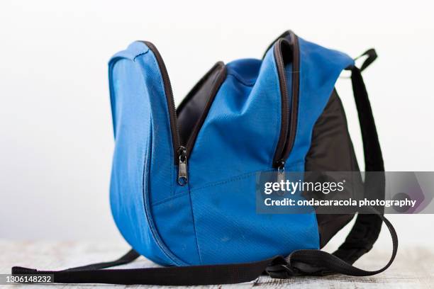 a blue small backpack - empty school bag stock pictures, royalty-free photos & images