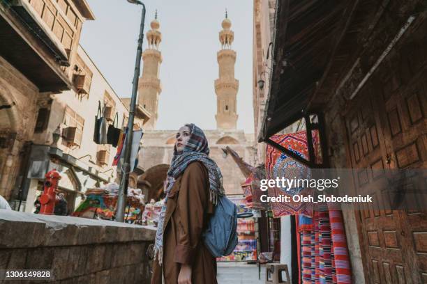 portrait of woman walking in the old town market in cairo - cidadela do cairo imagens e fotografias de stock