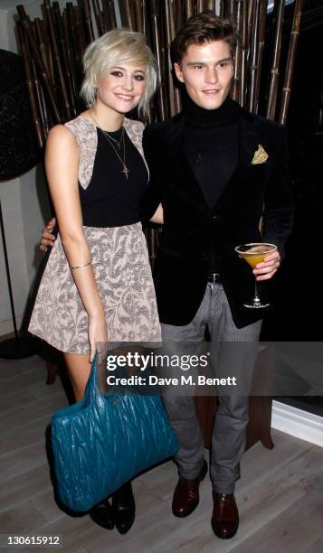 Singer Pixie Lott and guest attend the Senkai Restaurant Special Dinner at the Senkai restaurant on October 26, 2011 in London,England.