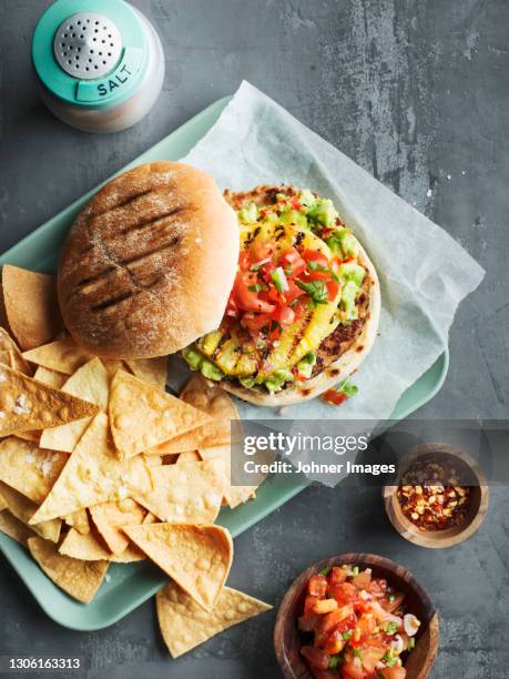 high angle view of burger and nachos - salt and pepper shaker overhead stock pictures, royalty-free photos & images