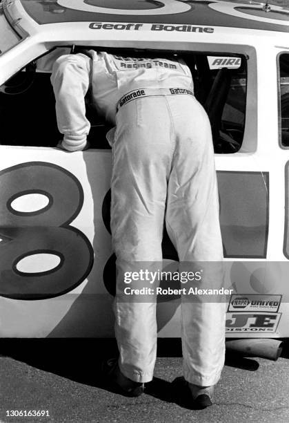 Driver Geoff Bodine leans into his racecar prior to the start of the 1983 Daytona 500 stock car race at Daytona International Speedway in Daytona...