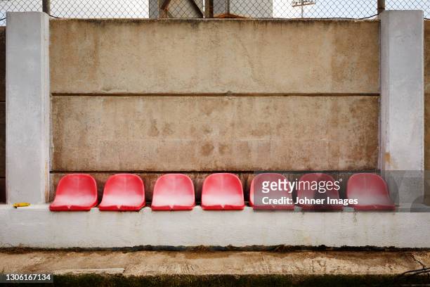 empty plastic seats - sports bench stock pictures, royalty-free photos & images