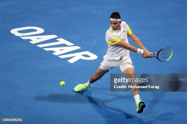 Filip Krajinovic of Serbia in action during his round one match against David Goffin of Belgium during Day 2 of the Qatar ExxonMobil Open 2021 at...