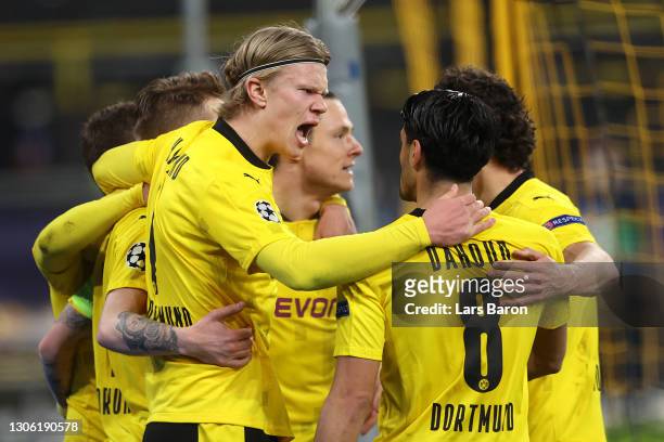 Erling Haaland of Borussia Dortmund celebrates with Mahmoud Dahoud after scoring their side's first goal during the UEFA Champions League Round of 16...