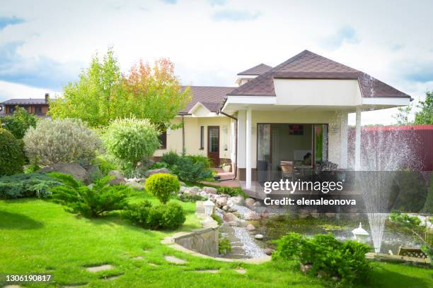 garden and pond - water fountain stock pictures, royalty-free photos & images