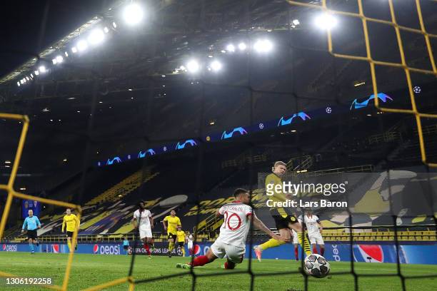 Erling Haaland of Borussia Dortmund scores their side's first goal during the UEFA Champions League Round of 16 match between Borussia Dortmund and...