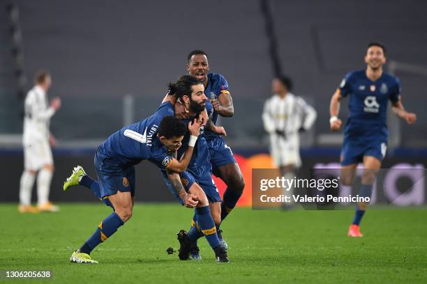 Sergio Oliveira of Porto celebrates with Luis Diaz and Wilson Manafa after scoring their side's second goal during the UEFA Champions League Round of...
