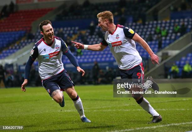 Eoin Doyle of Bolton Wanderers celebrates with Gethin Jones after scoring the opening goal during the Sky Bet League Two match between Bolton...