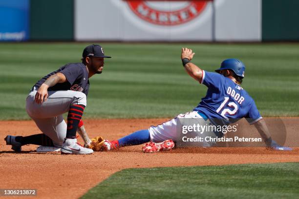 Infielder Gabriel Arias of the Cleveland Indians tags out Rougned Odor of the Texas Rangers at second base during the second inning of the MLB spring...