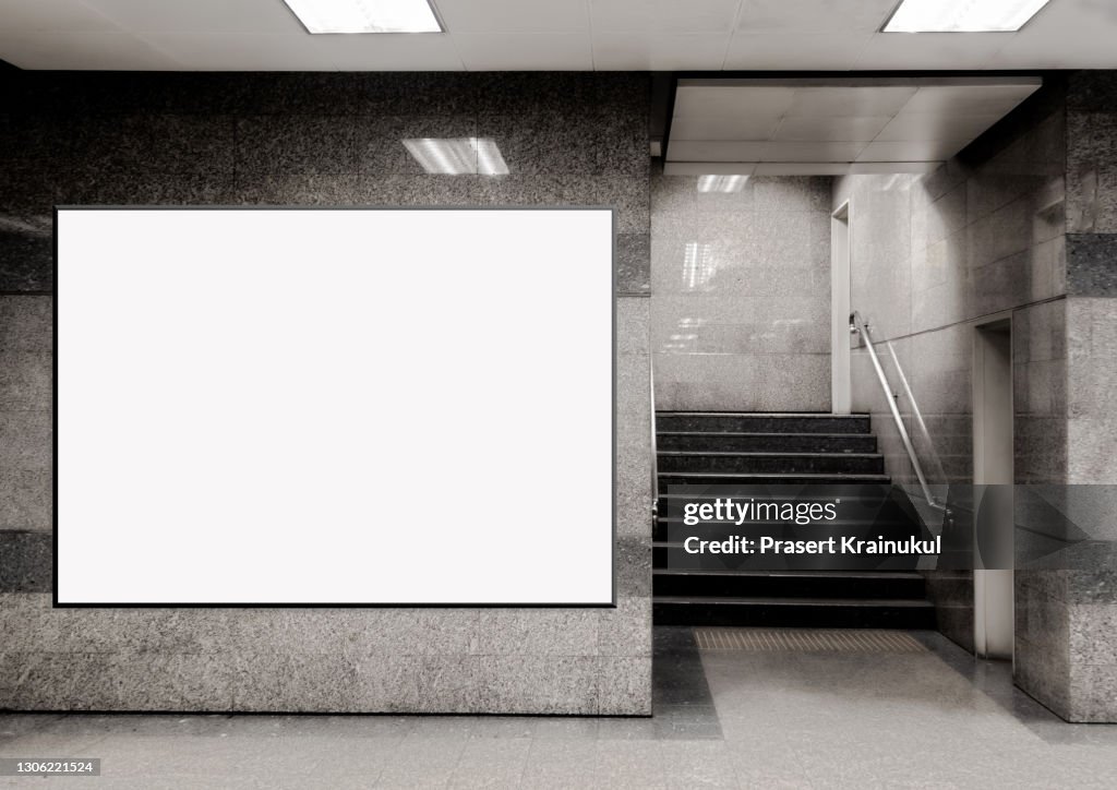 Blank billboard located in underground hall or subway for advertising, mockup concept