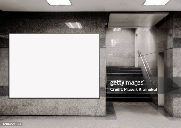 blank billboard located in underground hall or subway for advertising, mockup concept - panneau commercial photos et images de collection