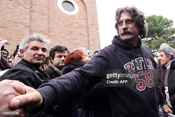 Paopo Simoncelli reacts during the funerals of his son, Italian MotoGP rider Marco Simoncelli on October 27, 2011 in Coriano, in the Rimini province....