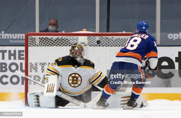 Anthony Beauvillier of the New York Islanders scores in the shootout against Jaroslav Halak of the Boston Bruins at the Nassau Coliseum on March 09,...
