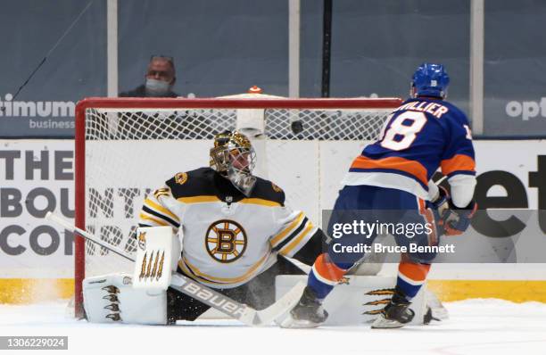 Anthony Beauvillier of the New York Islanders scores in the shootout against Jaroslav Halak of the Boston Bruins at the Nassau Coliseum on March 09,...