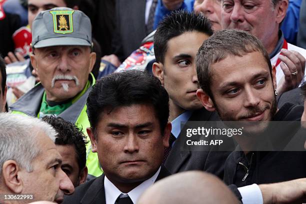 Italian MotoGP rider Valentino Rossi reacts during the funerals of Italian MotoGP rider Marco Simoncelli on October 27, 2011 in Coriano, in the...