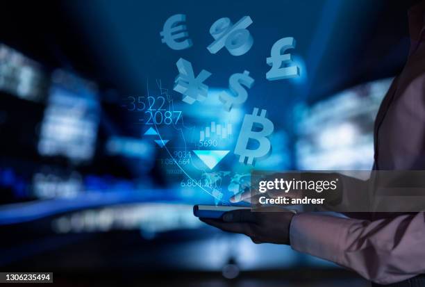 woman using a financial app to check the stock market - holograma stock pictures, royalty-free photos & images