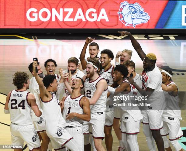 The Gonzaga Bulldogs celebrate on the court after their 88-78 victory over the Brigham Young Cougars to win the championship game of the West Coast...