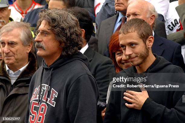 Italian rider Valentino Rossi attends the funeral service held for the MotoGP rider Marco Simoncelli with Paolo and Rossella Simoncelli, father and...