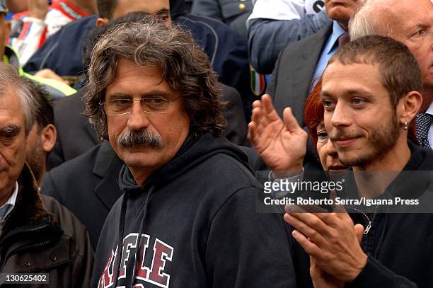 Italian rider Valentino Rossi attends the funeral service held for the MotoGP rider Marco Simoncelli with Paolo and Rossella Simoncelli, father and...