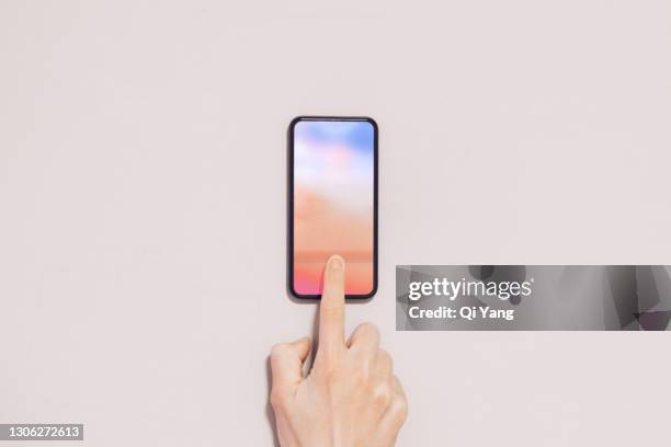 fingerprint unlocking - person touching digital display stock pictures, royalty-free photos & images