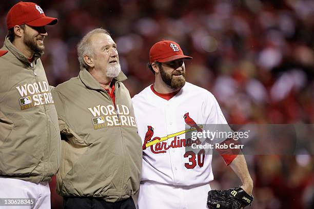 Adam Wainwright and Jason Motte of the St. Louis Cardinals pose for a photo with former Cardinals closer Bruce Sutter after the cermonial first pitch...