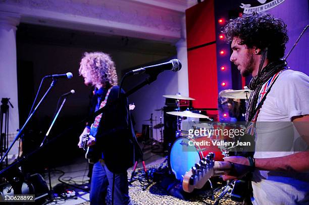 Nathaniel Hoho and Jessie Kotansky of The Click Clack Boom performs at Andy Hilfiger rock inspired clothing line called "Andrew Charles" during...