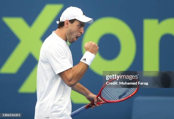 Aslan Karatsev of Russia celebrates winning the first set during his round of 16 match against Dominic Thiem of Austria during Day Three of the Qatar...