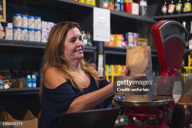 woman in her small grocery store. - 1 minute 50 stock pictures, royalty-free photos & images