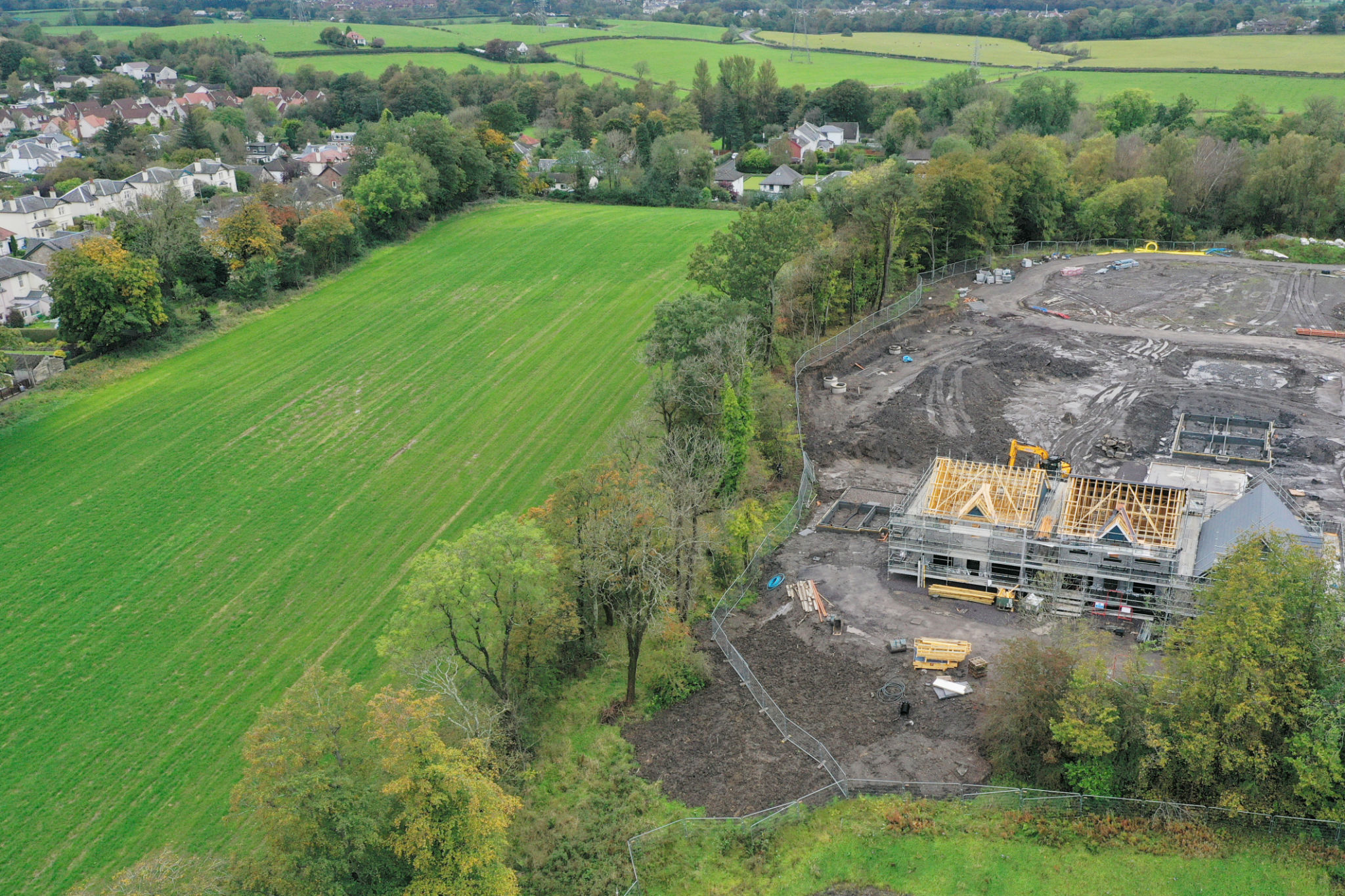 House development construction site in progress aerial view House development construction site in progress aerial view