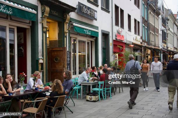 exterior view of a typical altbier pub on kurze straße in duesseldorf's old town. - altbier stock pictures, royalty-free photos & images