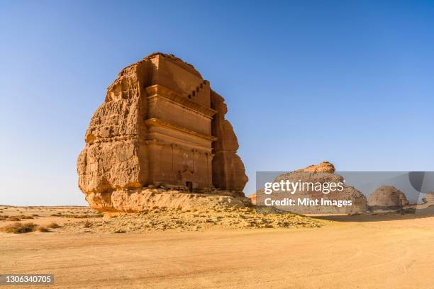 hegra, also known as mada’in salih, or al-ḥijr, archaeological site, nabatean carved rock cave tombs - sandstone stock pictures, royalty-free photos & images