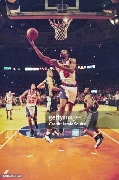 Latrell Sprewell, Shooting Guard for the New York Knicks makes a one handed lay up to the basket during Game 4 of the NBA Championship Finals...