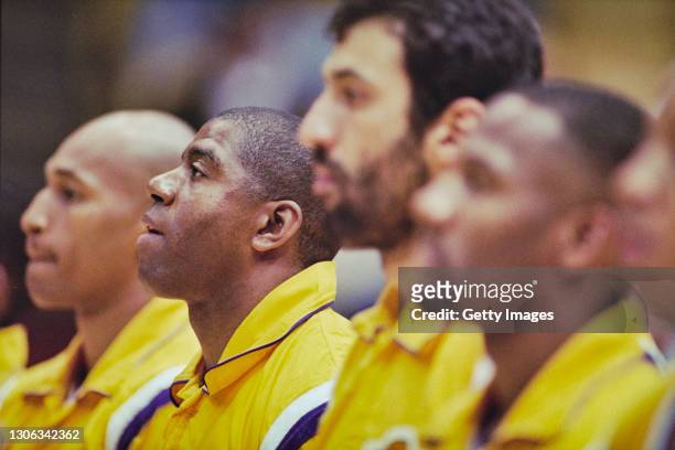 Magic Johnson, Shooting Guard and Power Forward for the Los Angeles Lakers lines up with his team mates for the national anthem before the NBA...