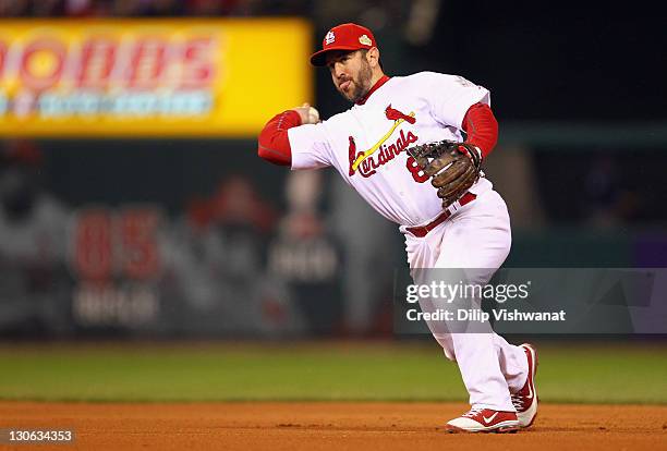 Nick Punto of the St. Louis Cardinals throws the ball to first base against the Texas Rangers during Game One of the MLB World Series at Busch...