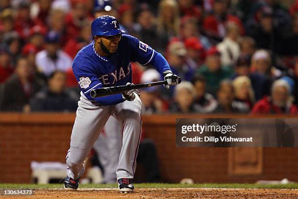 Elvis Andrus of the Texas Rangers attempts a bunt against the St. Louis Cardinals during Game One of the MLB World Series at Busch Stadium on October...