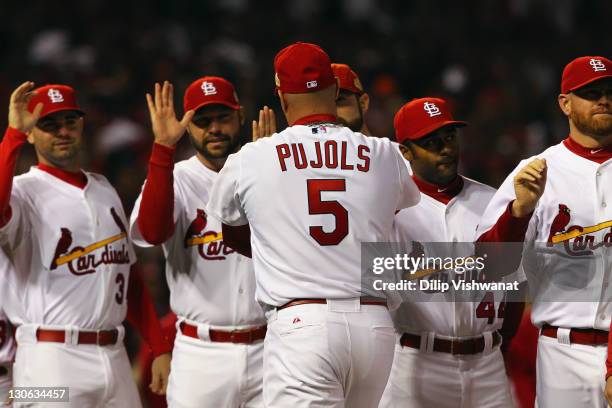 Albert Pujols of the St. Louis Cardinals greets his teammates during player introductions against the Texas Rangers during Game One of the MLB World...