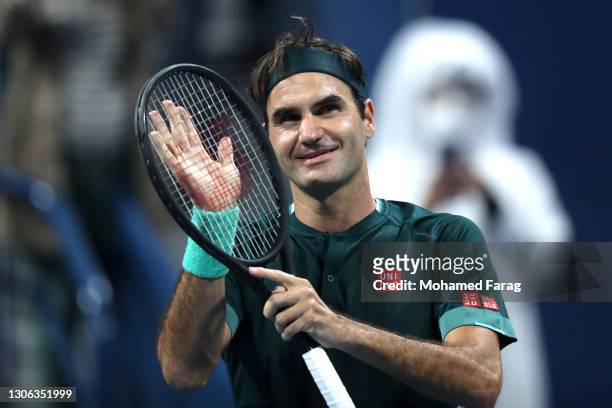 Roger Federer of Switzerland celebrates winning his match against Dan Evans of Great Britain on Day 3 of the Qatar ExxonMobil Open at Khalifa...