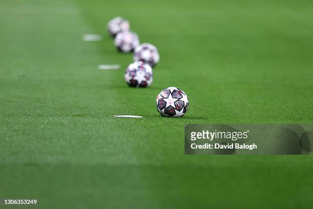 The Adidas Finale 21 match ball's are seen on the pitch prior to the UEFA Champions League Round of 16 match between Liverpool FC and RB Leipzig at...