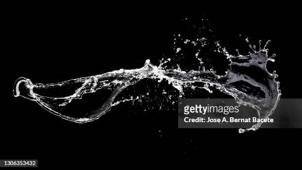 shock of liquids (water) that produce splashes and drops on a black background. - zusammenprall stock-fotos und bilder