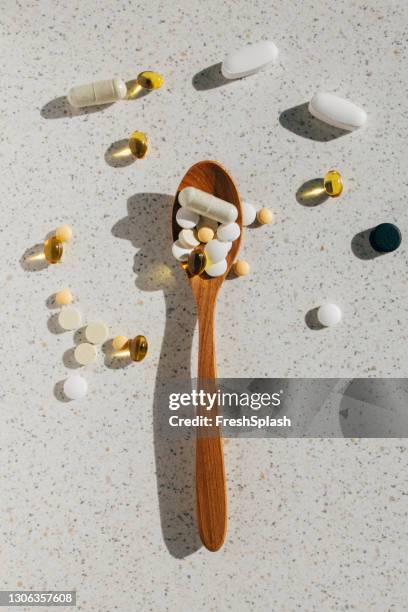 close-up shot of different supplements in a teaspoon - spoon stock pictures, royalty-free photos & images