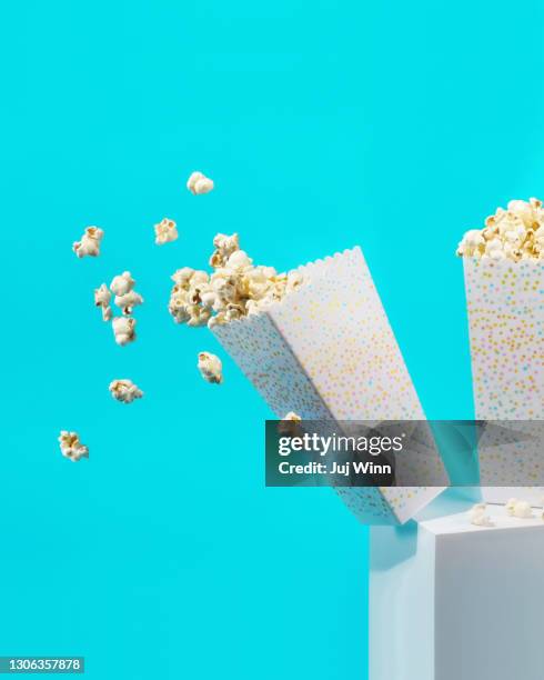 box of popcorn falling. - gravity film stock pictures, royalty-free photos & images