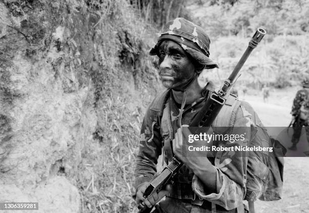 View of a Salvadoran Army soldier, from the Atlacatl Battalion, during a military operation, Tenancingo, El Salvador, September 27, 1983. At the...