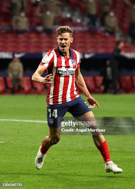 Marcos Llorente of Atletico Madrid celebrates after scoring their team's first goal during the La Liga Santander match between Atletico de Madrid and...