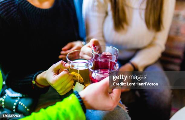 hands of friends with tea cups - hot drink stock pictures, royalty-free photos & images