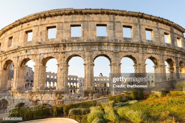 a wall fragment of ancient roman amphitheater pula, istria, croatia - pula stock-fotos und bilder