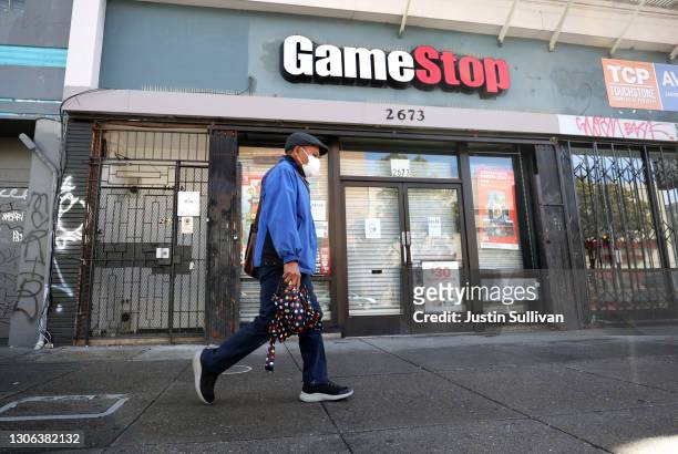 Pedestrian walks by a GameStop store on March 10, 2021 in San Francisco, California. Trading of GameStop shares was halted several times on Wednesday...