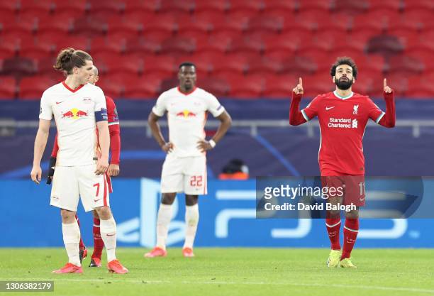 Mohamed Salah of Liverpool celebrates after scoring their side's first goal during the UEFA Champions League Round of 16 match between Liverpool FC...